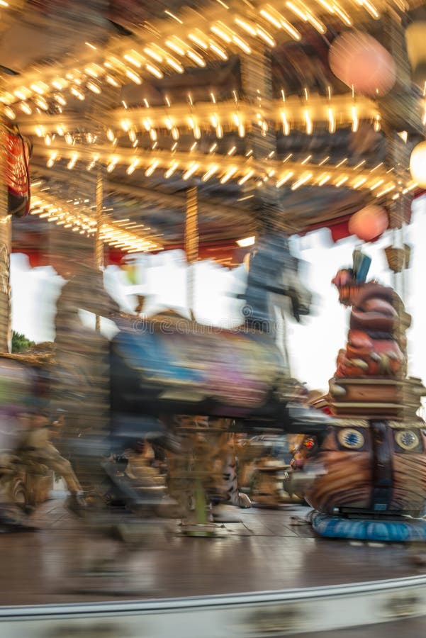Carousel with horses in amusement park royalty free stock photo