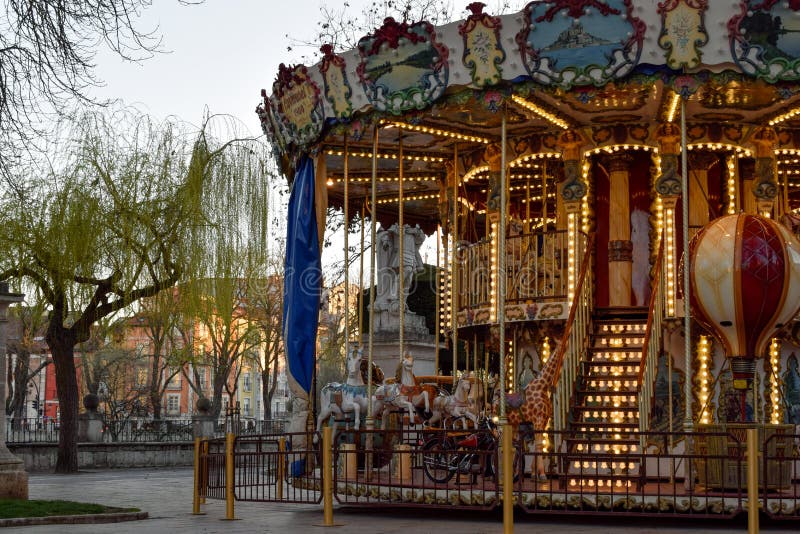 Carousel with lights on a city walk