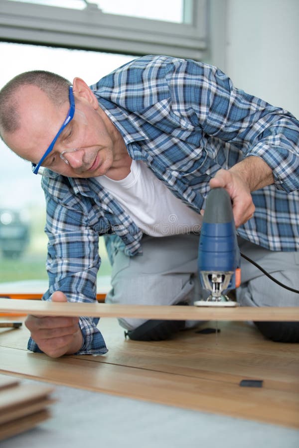 Carpenter cutting wood stock photo. Image of blade, cutting 96540496