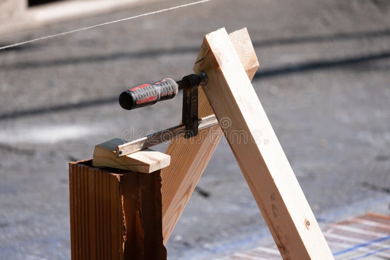 A Carpenter`s Clamp Clamps Two Pieces of Wood Together To Form the