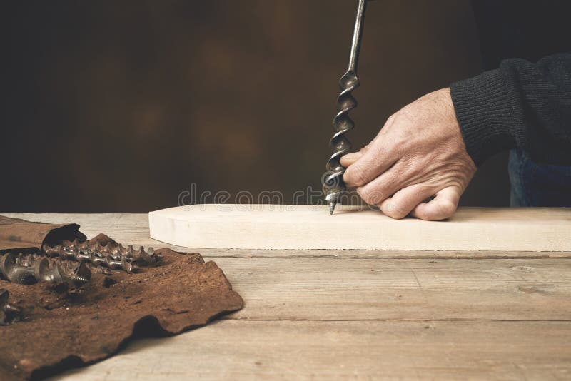 Carpenter's Hand Ready To Drill Wood Stock Photos Free & RoyaltyFree