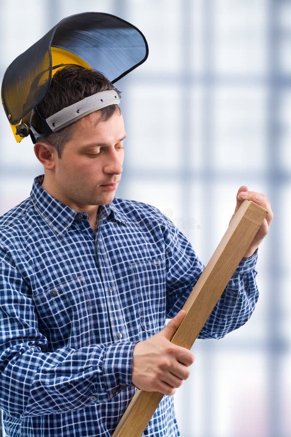 Carpenter take the wooden board