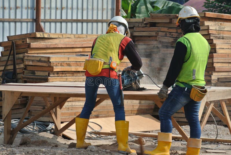 Carpenter Using Circular Saw At The Construction Site ...