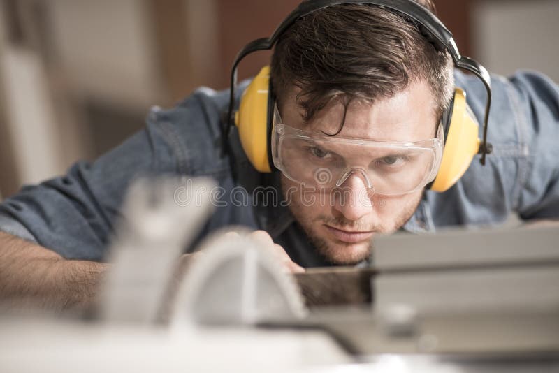 Carpenter Using Protective Headphones Stock Image Image of industrial