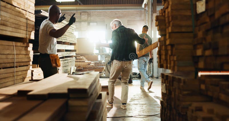 Carpenter, wood and dance with people in warehouse for furniture production, fun celebration and industry. Success stock photo