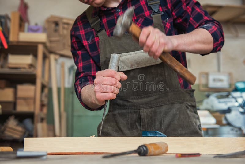 Man working with a chisel stock photo. Image of 55337786