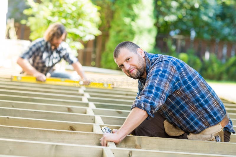 Carpenter Working At Construction Site stock photography