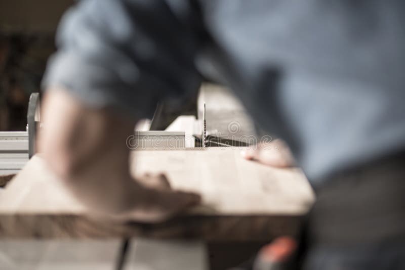 Carpenter working with a plank of wood. Carpenter working with a plank of wood