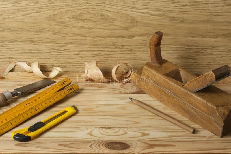 Set of Tools at Wooden Table. Meter Measuring Line Construction Level and Square Ruler
