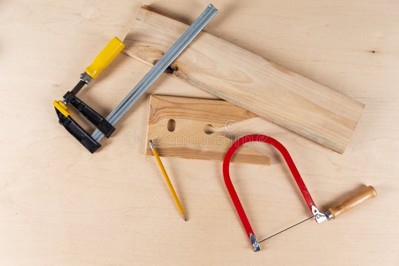 Carpentry Concepts and Ideas. Lineup of Assorted Work Tools on Wood