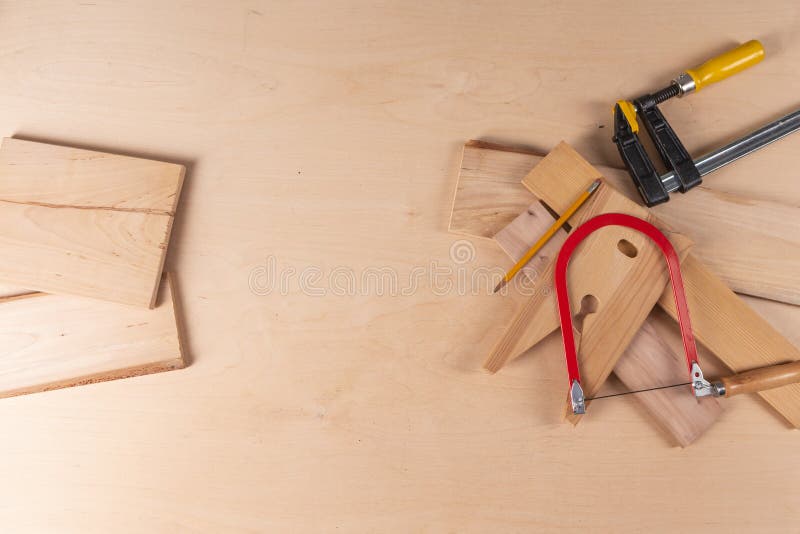 Carpentry Concepts and Ideas. Lineup of Assorted Work Tools on Wood
