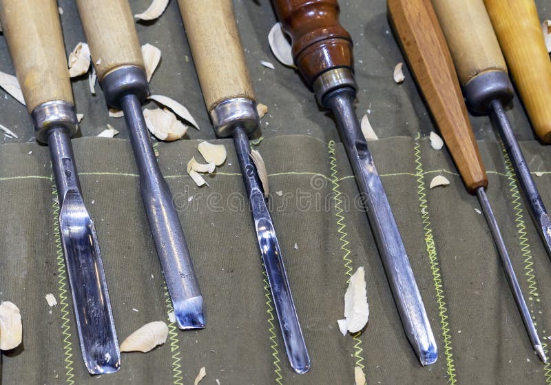 Carpentry Tools for Wood Carving on the Table with Sawdust Stock Image