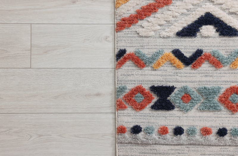 Carpet with Beautiful Pattern on Floor, Top View. Space for Text Stock