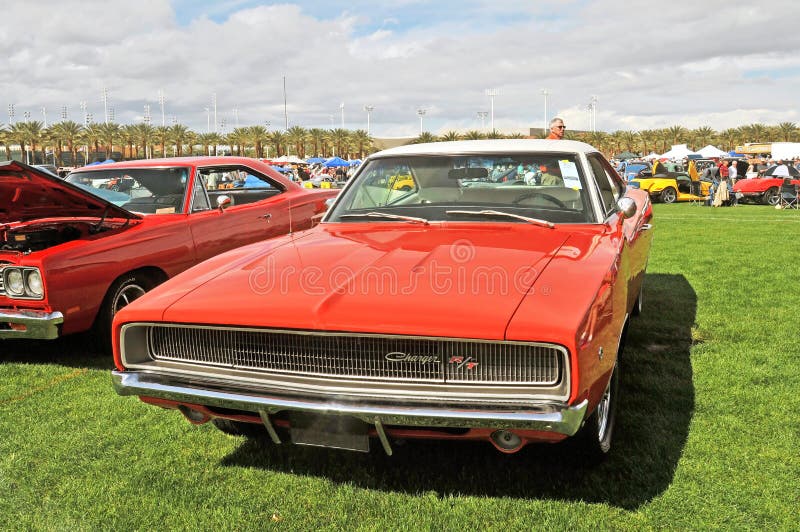 The 1970 Dodge Charger R/T was built as a two door sedan with a long hood and short deck in a fastback body design. Note the white vinyl top. The base engine was a 318 C.I. V-8 but other engine options were available. The 1970 Dodge Charger R/T was built as a two door sedan with a long hood and short deck in a fastback body design. Note the white vinyl top. The base engine was a 318 C.I. V-8 but other engine options were available.