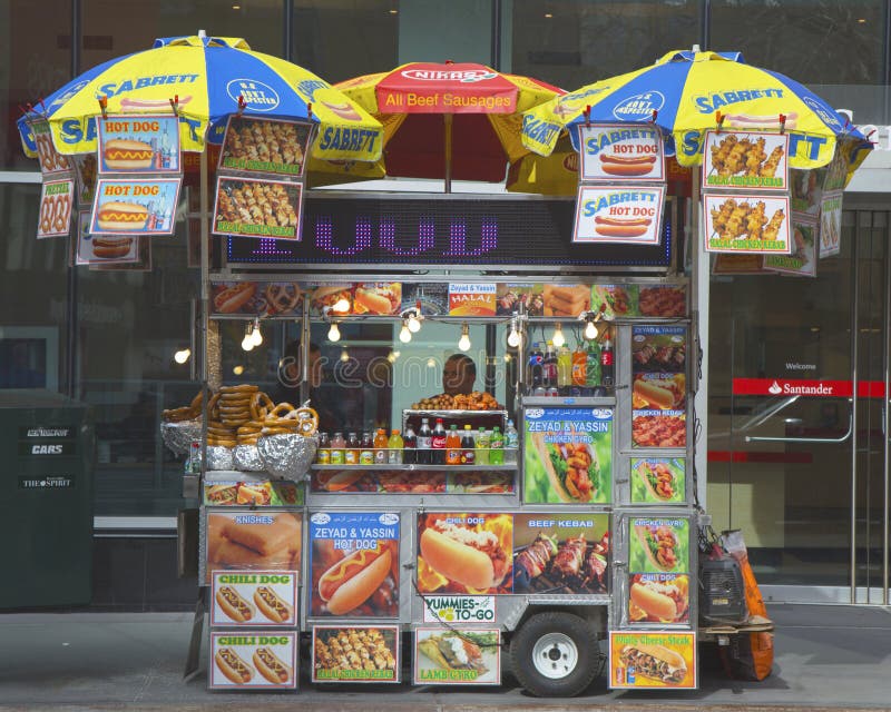NEW YORK -APRIL 1: Street vendor cart in Manhattan on April 1, 2014. There are about 4, 000 mobile food vendors licensed by the city. NEW YORK -APRIL 1: Street vendor cart in Manhattan on April 1, 2014. There are about 4, 000 mobile food vendors licensed by the city