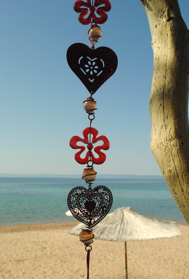 Wind chime centered on sea background. Wind chime centered on sea background