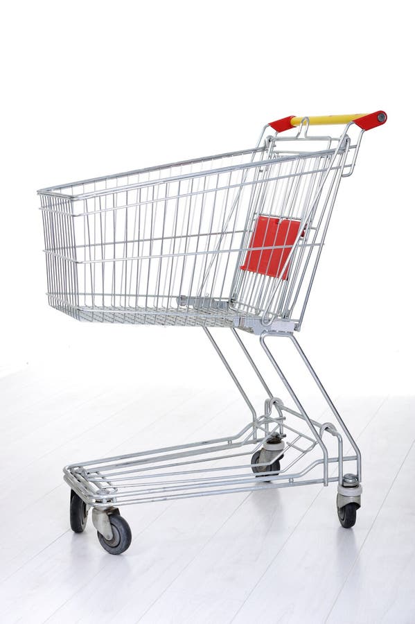 Carro de compra no branco fotografia de stock royalty free Carro de compra no branco fotografia de stock royalty free