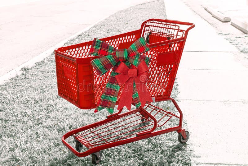 Carro de la compra rojo brillante del día de fiesta con dos arcos o el lado imagenes de archivo Carro de la compra rojo brillante del día de fiesta con dos arcos o el lado imagenes de archivo