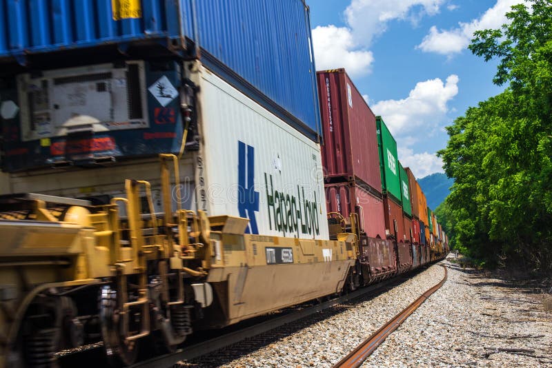Roanoke, VA â€“ May 30: Norfolk and Southern train hauling stacked box cars to market on 30th of May 2015. Roanoke, VA â€“ May 30: Norfolk and Southern train hauling stacked box cars to market on 30th of May 2015.