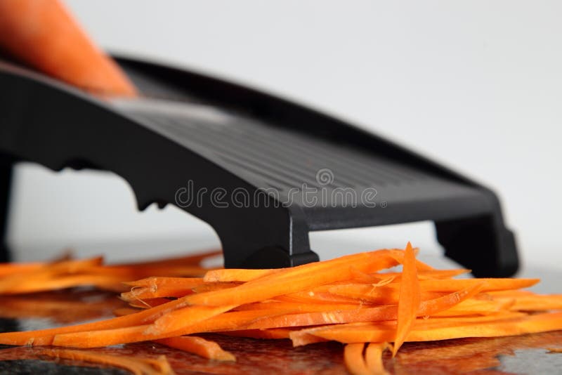 Carrot cut on mandolin stock image. Image of food, carrot 95291813