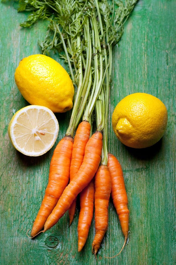 Carrots and lemons stock photo. Image of lemon, isolated 14915016