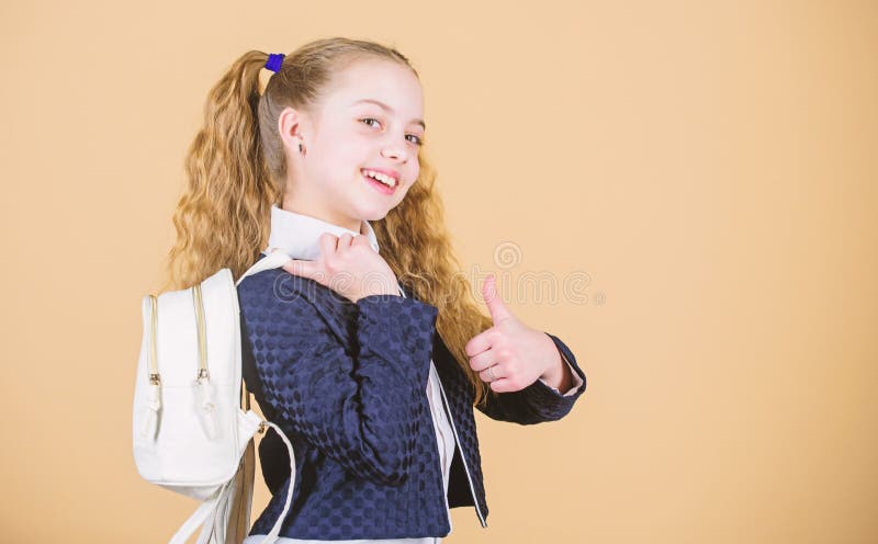 Carrying things in backpack. Learn how fit backpack correctly. Girl little fashionable cutie carry backpack. Popular.
