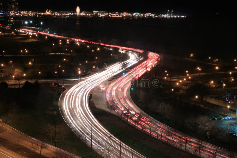 Cars on highway by lake