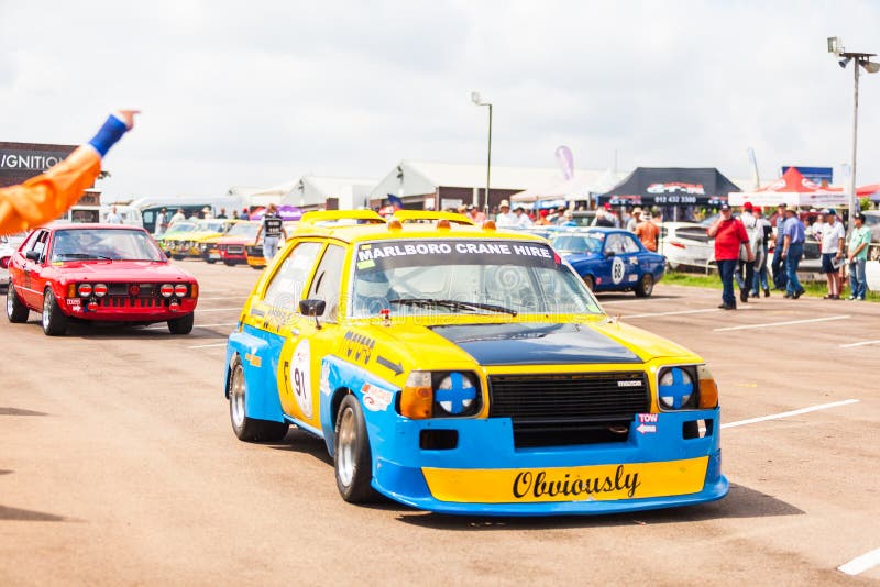 Race cars line up on the tarmac before a race on zwartkops raceway near Pretoria, South Africa. Race cars line up on the tarmac before a race on zwartkops raceway near Pretoria, South Africa.