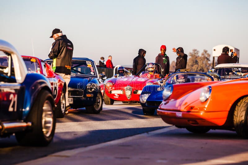 A historic car race held at the Kyalami racetrack in July 2014. Cars line up on the starting line at Kyalami race track on a cold winter morning. South Africa.