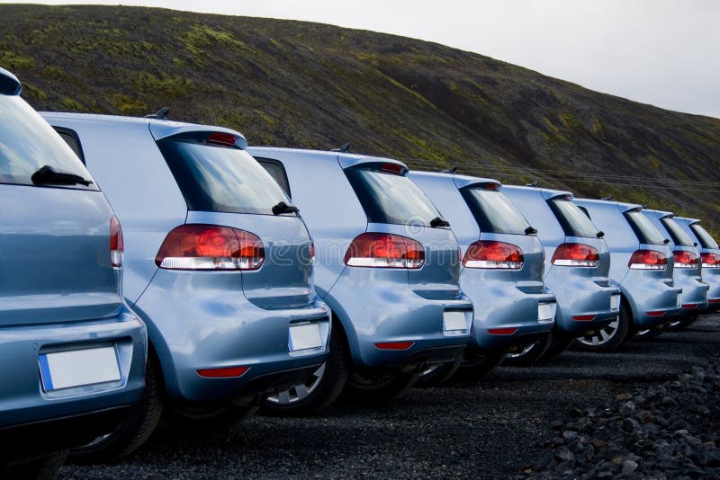 Cars parked in a row stock photo. Image of perspective 6753914