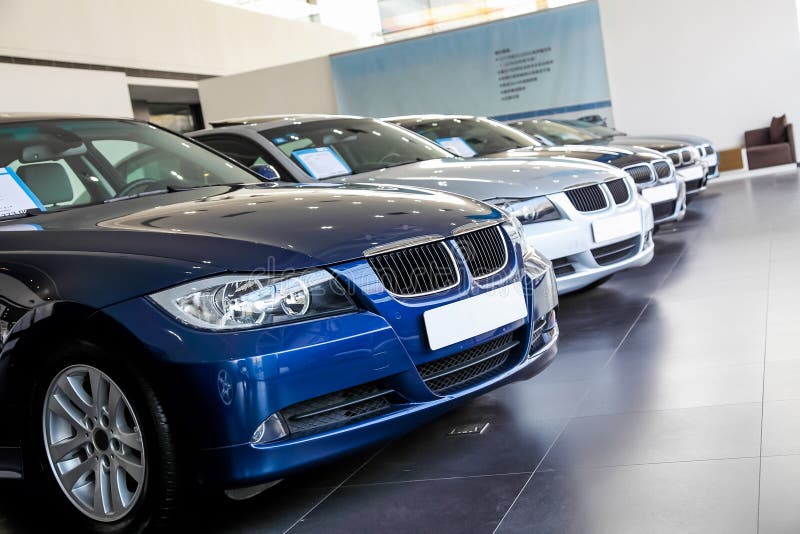 Lined up cars in dealership showroom for sale. Cars stock imagesroyalty-free photos and pictures
