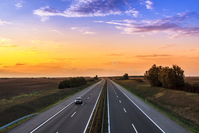 Cars speeding on a highway