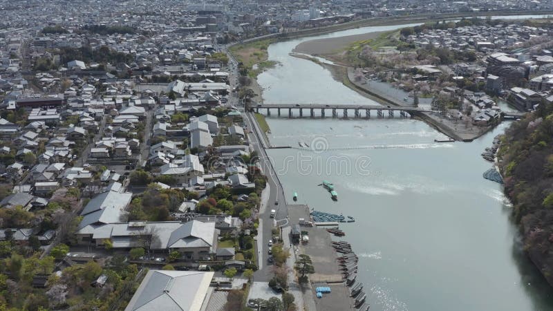 Aerial view of Cars traveling over Arashiyama Togetsukyo Bridge in Kyoto, Japan