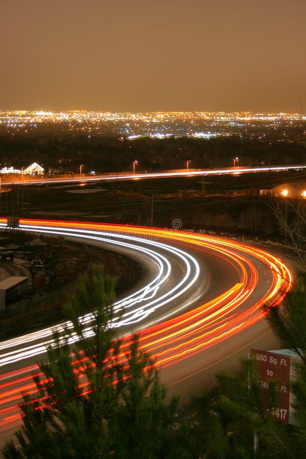 Cars and trucks zoom down the highway