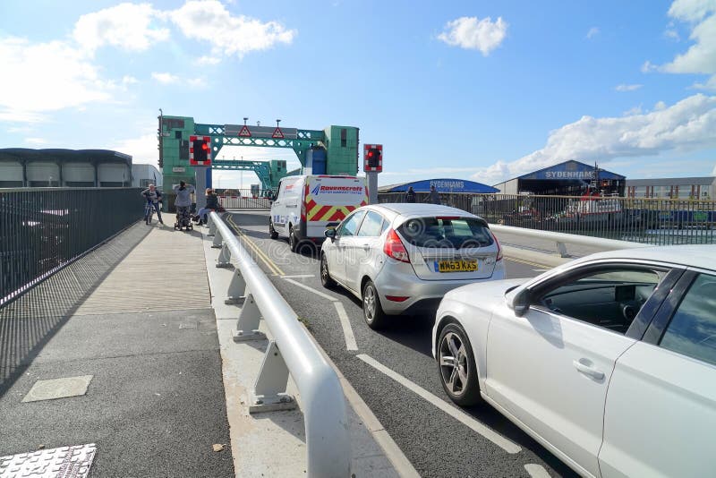 Cars waiting at closed bridge stock images