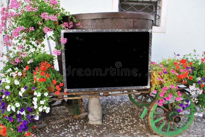 Cart with flowers and table information