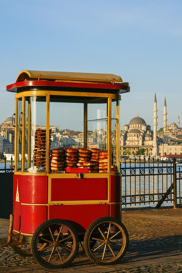 Cart with Turkish bagels known as Simit with the skyline of Istanbul, Turkey. Cart with Turkish bagels known as Simit with the skyline of Istanbul, Turkey