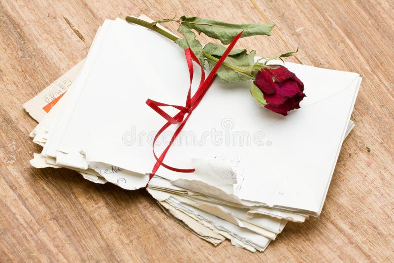 Vintage love letters with red rose over wood background. Vintage love letters with red rose over wood background