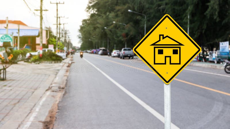 Yellow sign with graphic of house to warn traffics to beware of neighborhood area. Yellow sign with graphic of house to warn traffics to beware of neighborhood area