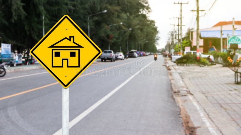 Yellow sign with graphic of house to warn traffics to beware of neighborhood area. Yellow sign with graphic of house to warn traffics to beware of neighborhood area