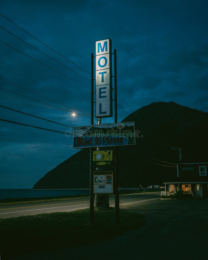 Travel photograph of hôtel Motel Mont-St-Pierre sign at night Mont-Saint-Pierre Québec Canada. Travel photograph of hôtel Motel Mont-St-Pierre sign at night Mont-Saint-Pierre Québec Canada