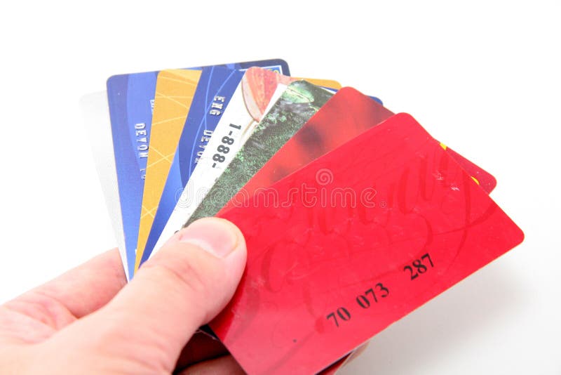 Cartes de crédit de prise de main image libre de droits Cartes de crédit de prise de main image libre de droits