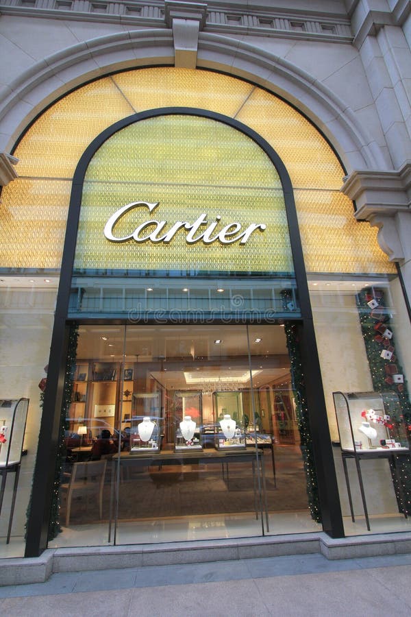 Red coupe infront of cartier shop photo – Free Luxury Image on
