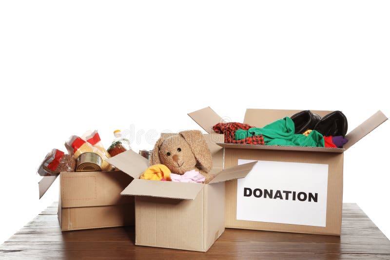 Carton boxes with donations on table