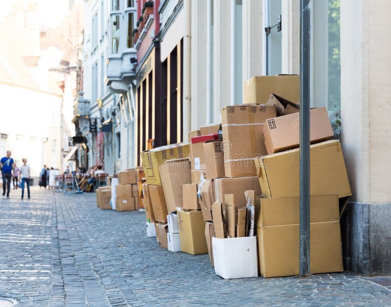 Carton garbage boxes on sidewalk, european city