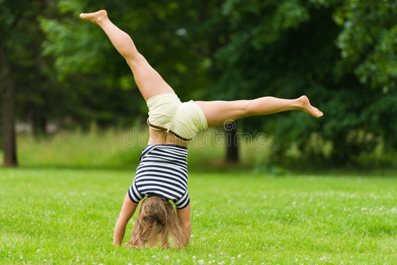 Cartwheel stock photo. Image of aerobic, long, hair, human 25678636