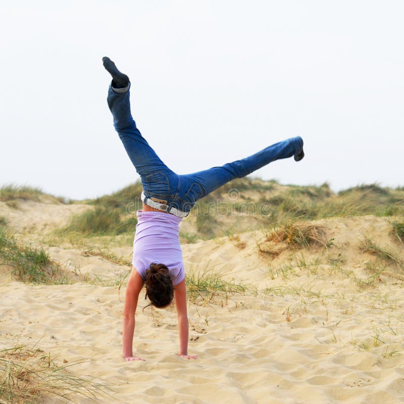 Cartwheel girl stock image. Image of acrobatic, sand, cartwheel 3728143