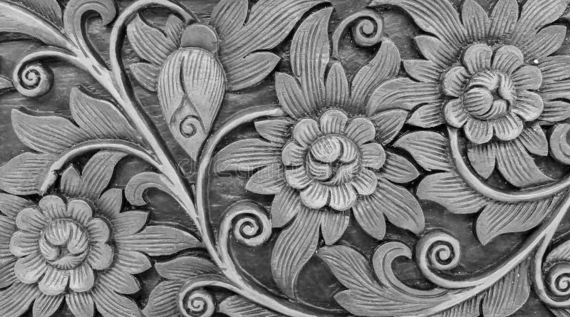 Carved Monotone Vintage Style Floral Pattern on Wooden Background Texture for Furniture Material or used as Bea