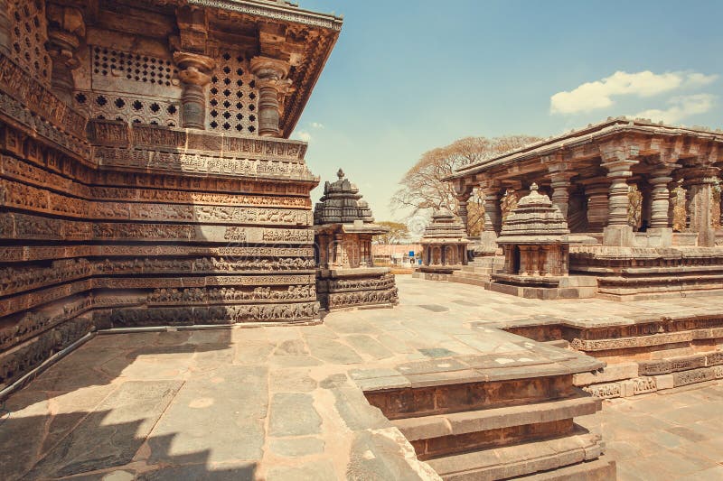 Carved stone walls of beautiful temple buildings of Halebidu, with reliefs of 12th century Hoysaleshwara temple, India stock photography Carved stone walls of beautiful temple buildings of Halebidu, with reliefs of 12th century Hoysaleshwara temple, India stock photography