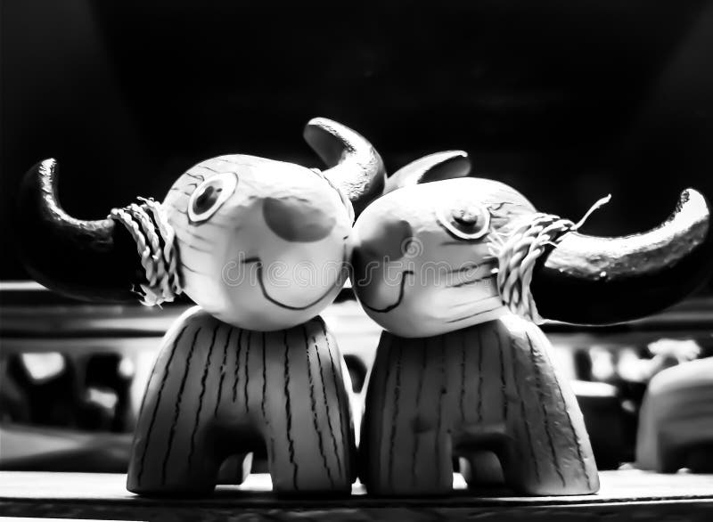 Carved wood buffalo loved each other black and white tones. royalty free stock photos Carved wood buffalo loved each other black and white tones. royalty free stock photos